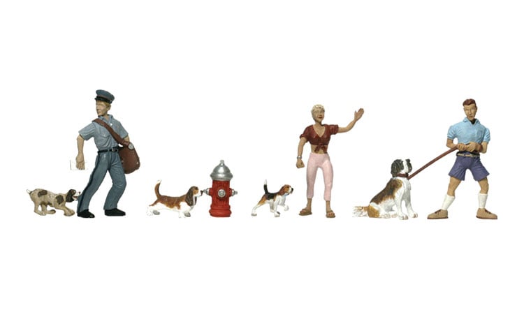 People & Pets - HO Scale - This set includes a mailman, a man and a woman in various 'canine' situations, four dogs and a fire hydrant
