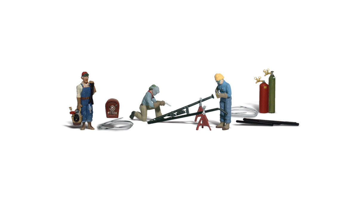 Welders & Accessories - HO Scale - A set of three men, with protective welding helmets and gloves, working with an assortment of mig and spot welders, a plasma cutter and gas cylinders - complete with angle iron pieces