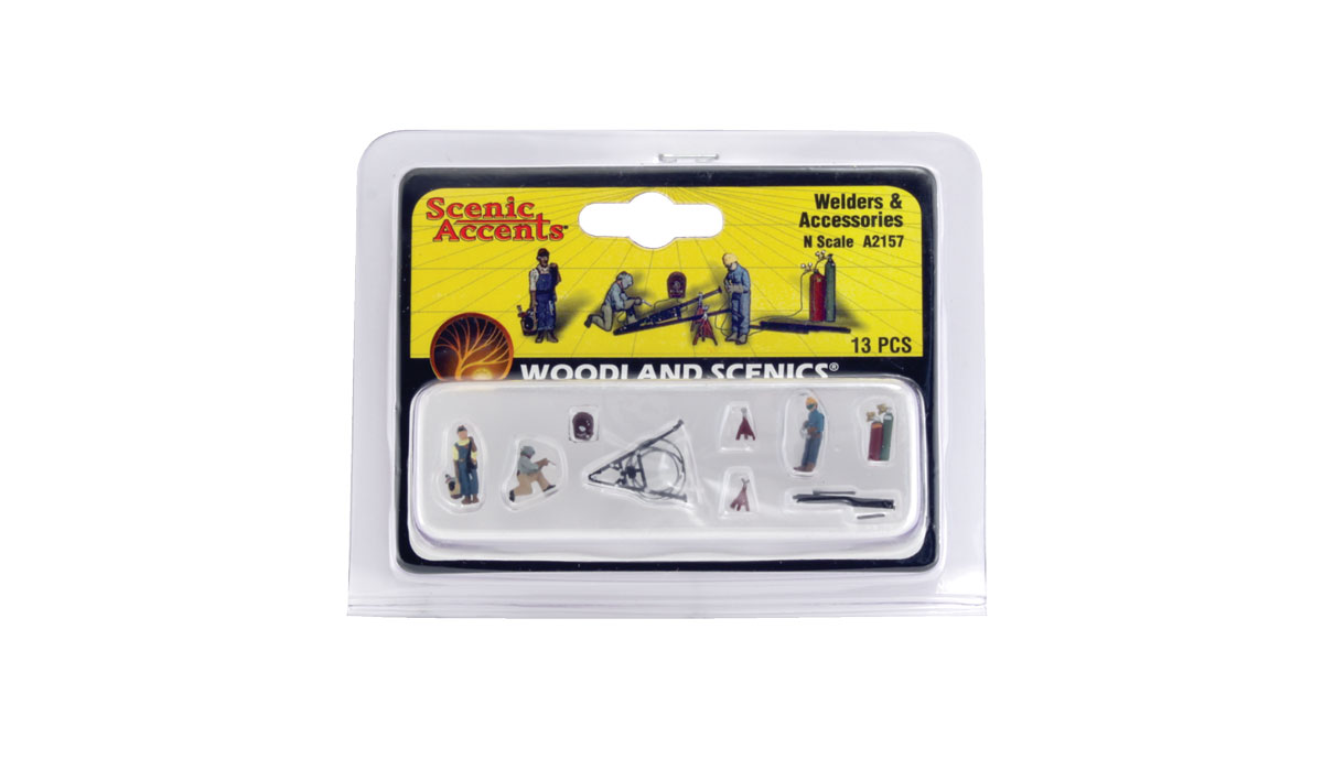 Welders & Accessories - N scale - A set of men, with protective welding helmets and gloves, work with an assortment of mig and spot welders, a plasma cutter and gas cylinders - complete with angle iron pieces