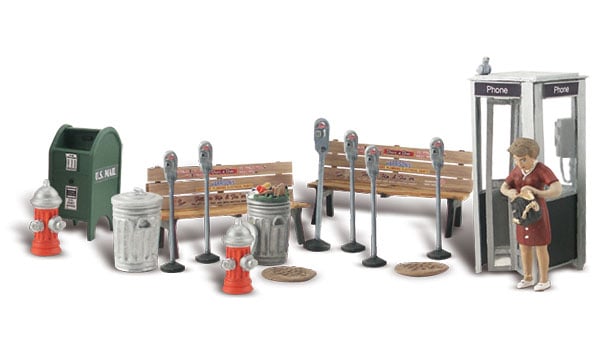 Street Accessories - O Scale - This set includes six parking meters, manhole covers, fire hydrants, trashcans, resting benches, street corner mailbox, a vintage folding-door telephone booth and a woman rummaging in her purse for some change