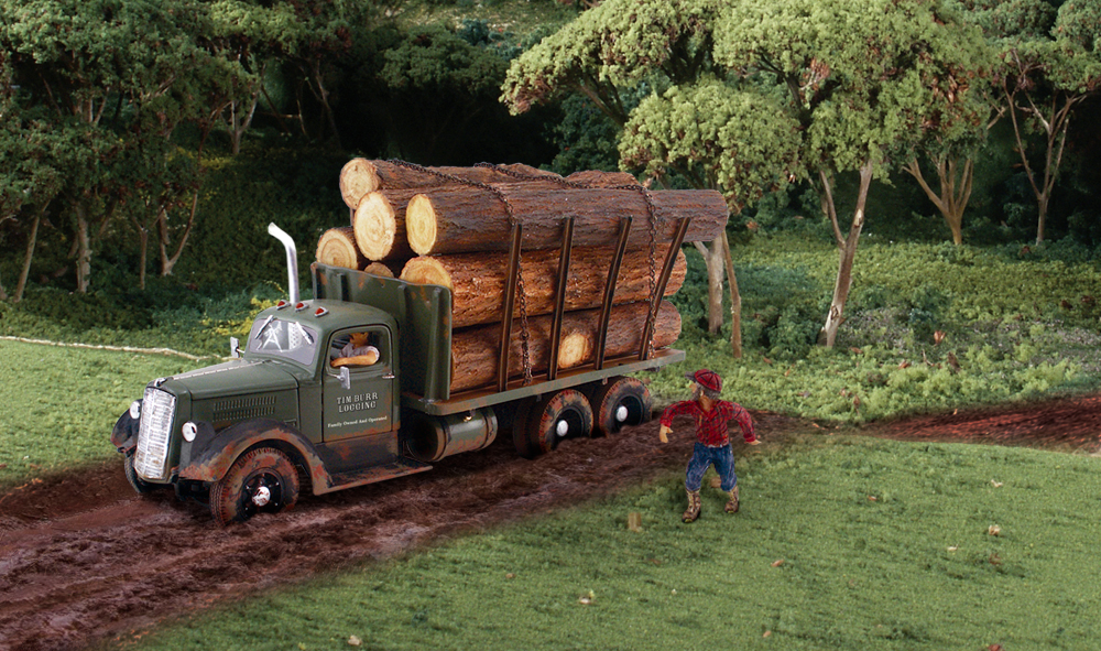 Tim Burr Logging - N Scale - Tim shouts last-minute instructions to his driver who takes the lumbering load of logs to the sawmill