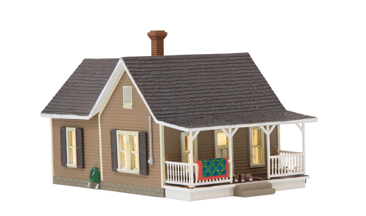 Granny's House - N Scale - Granny's House is a quaint little home with a rose arbor and Granny's living room rug airing out on the porch