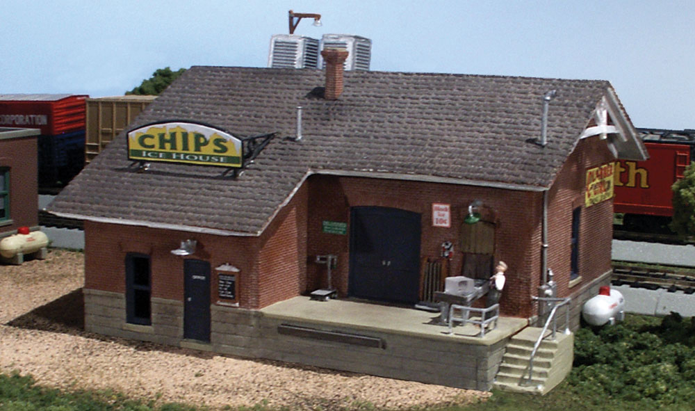 Chip's Ice House - N Scale - Chip is one cool dude operating one cool business! Chip&rsquo;s Ice House is designed in full architectural detail with accessories that include a conveyor, gas tank, rooftop compressors and an easy-access loading dock