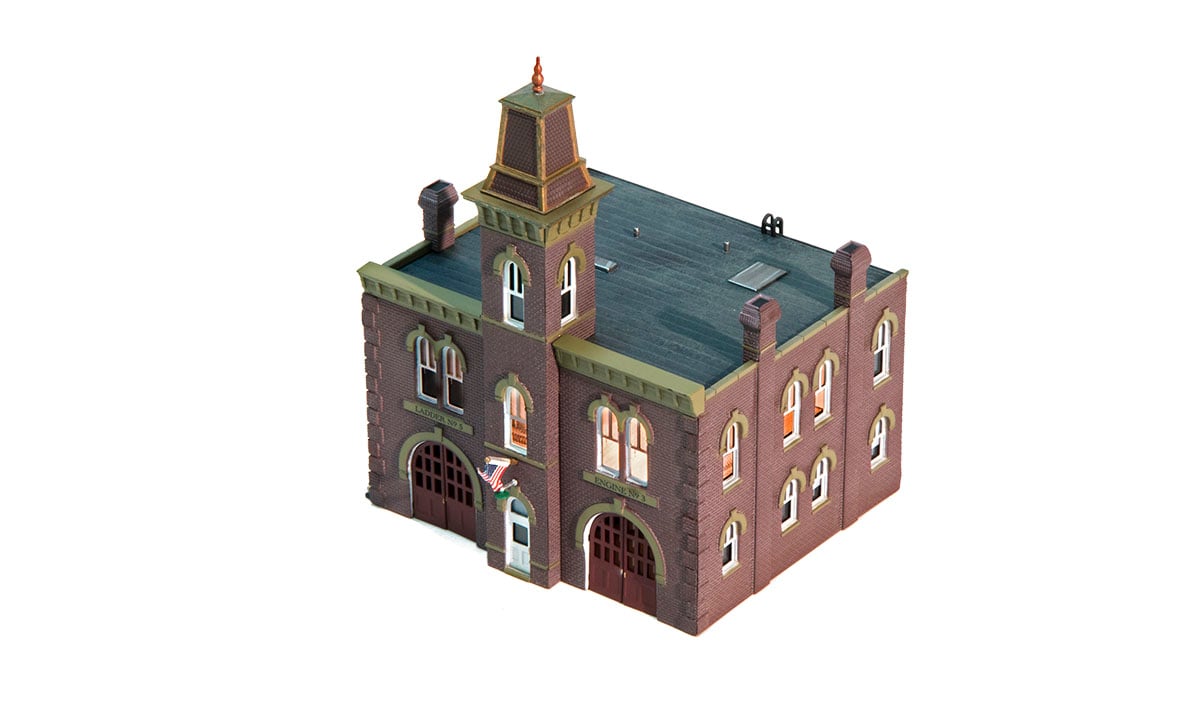 Firehouse - N Scale - It's a three-alarm fire, but your layout residents are sure to receive a quick response from firefighters answering the call