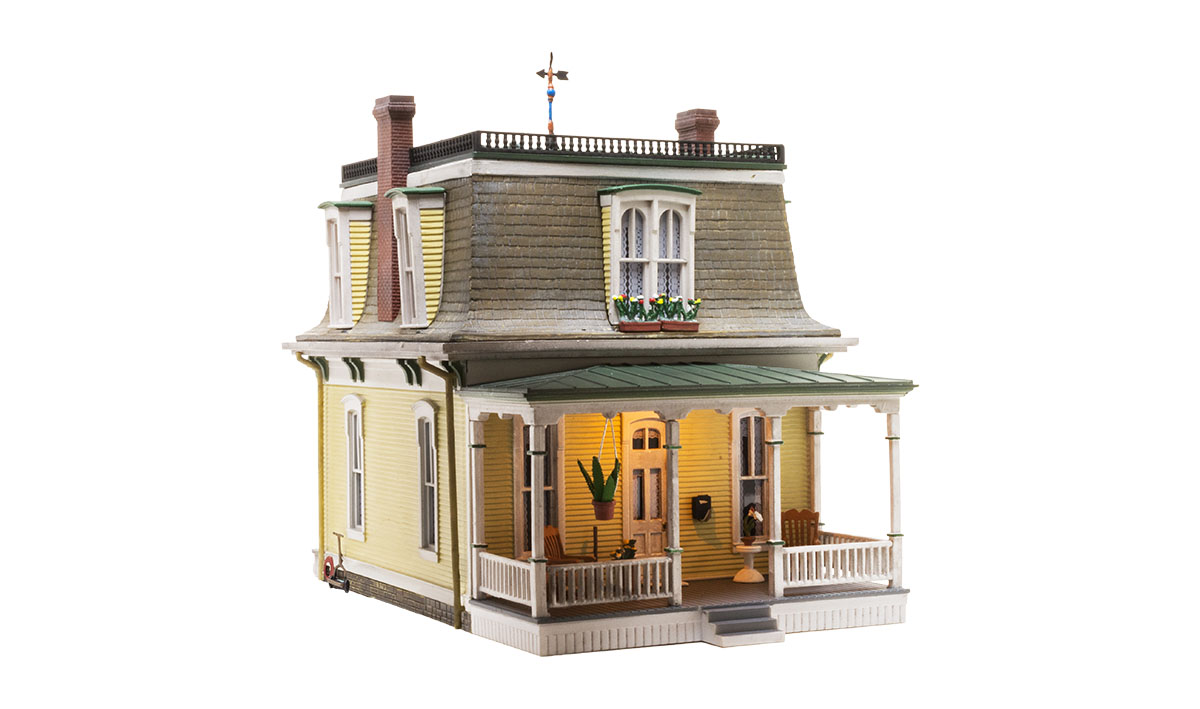 Home Sweet Home - N Scale - This Home Sweet Home features classic Victorian architecture housed under a characteristic Mansard roof, a vintage weather vane, and intricately styled dormers complete with flowered window boxes