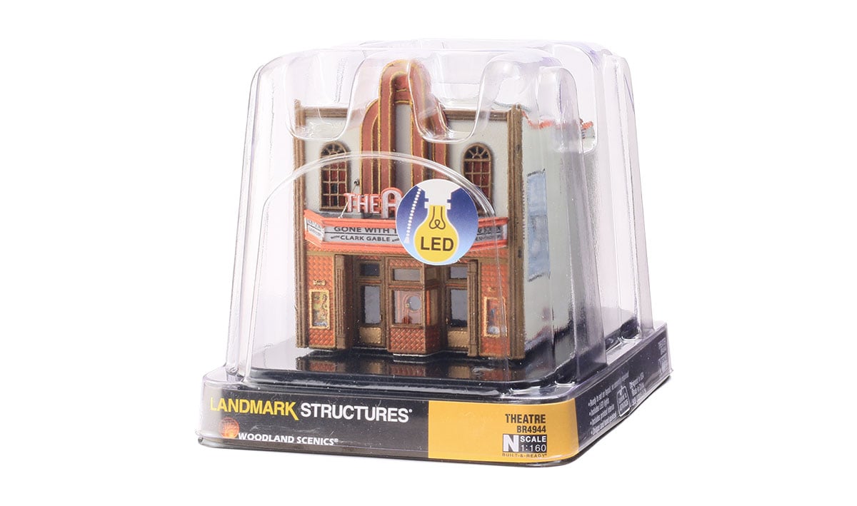 Theatre - N Scale - The Theatre offers classic vintage architecture, an expertly weathered stucco-over-brick exterior, tall arched windows, gilded kick plates on front doors, a decorative tile facade and carved wood trim