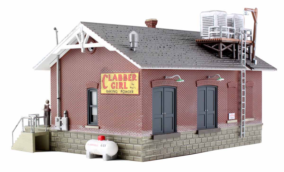Chip's Ice House - HO Scale - Chip is one cool dude operating one cool business! This structure is designed in full architectural detail with accessories that include a conveyor, gas tank, rooftop compressors and an easy-access loading dock