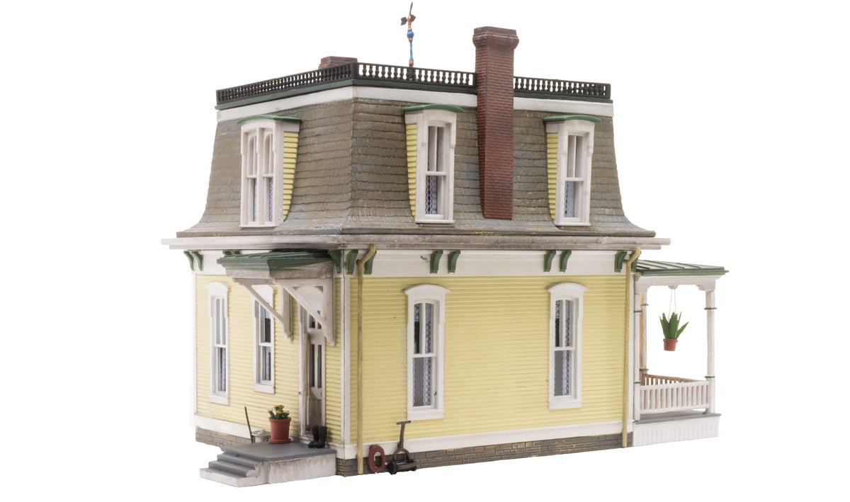 Home Sweet Home - HO Scale - This Home Sweet Home features classic Victorian architecture housed under a characteristic Mansard roof, a vintage weather vane, and intricately styled dormers complete with flowered window boxes
