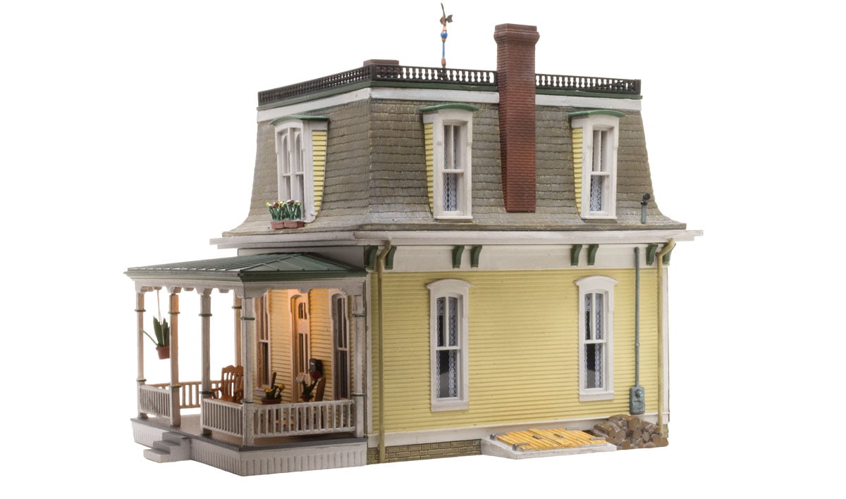 Home Sweet Home - HO Scale - This Home Sweet Home features classic Victorian architecture housed under a characteristic Mansard roof, a vintage weather vane, and intricately styled dormers complete with flowered window boxes