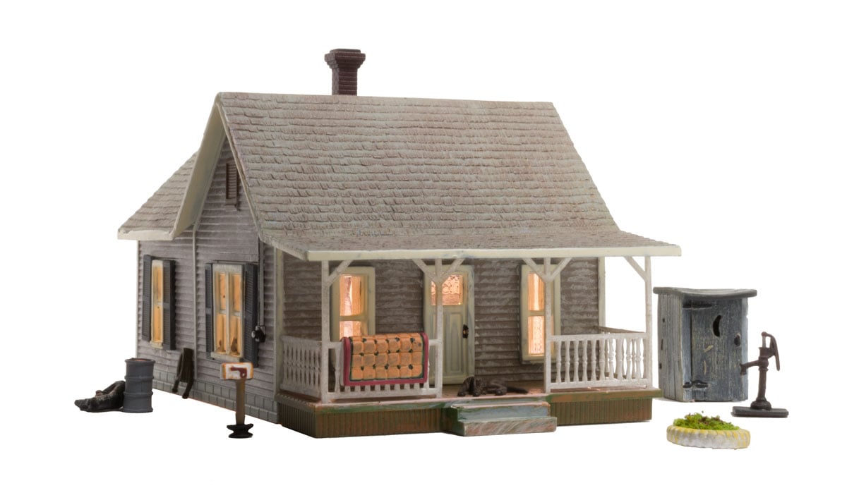Old Homestead - HO Scale - The Old Homestead is a bit rough around the edges and the perfect representation of an old rural bungalow, beautifully weathered and loaded with detail