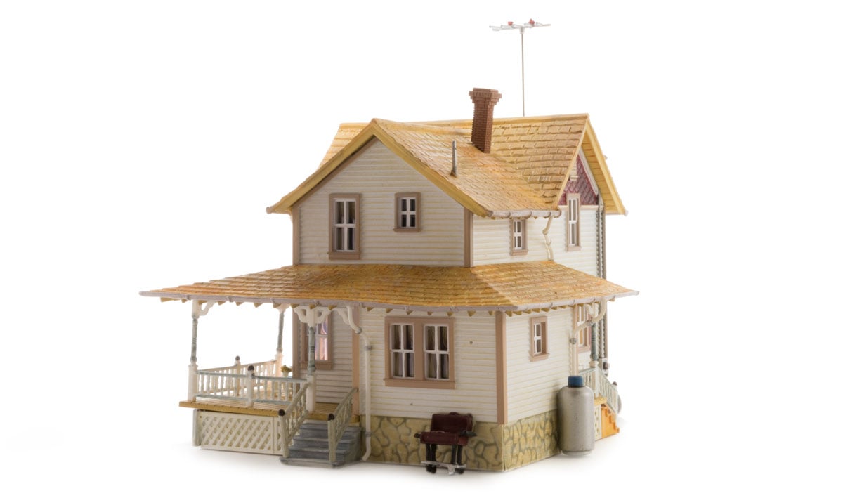 Corner Porch House - HO Scale - The Corner Porch House is a two-story home with a cedar-shake roof and a corner wrap-around porch