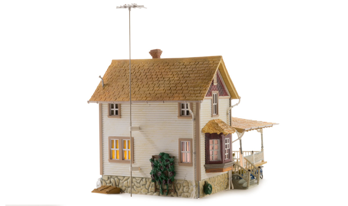 Corner Porch House - HO Scale - The Corner Porch House is a two-story home with a cedar-shake roof and a corner wrap-around porch