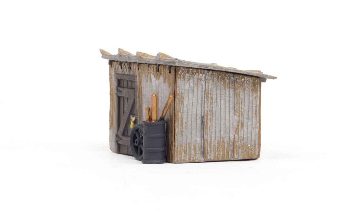 Tin Shack - HO Scale  - The Tin Shack's rusted metal walls and weather beaten door shows its true age after standing tall through rain, sun, and snow