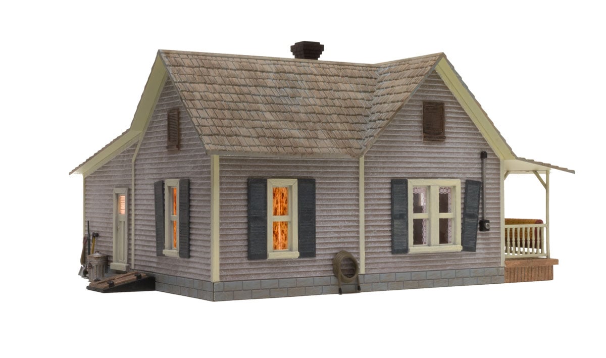 Old Homestead - O Scale - The Old Homestead is a bit rough around the edges and the perfect representation of an old rural bungalow, beautifully weathered and loaded with detail including old Bowser asleep on the front porch