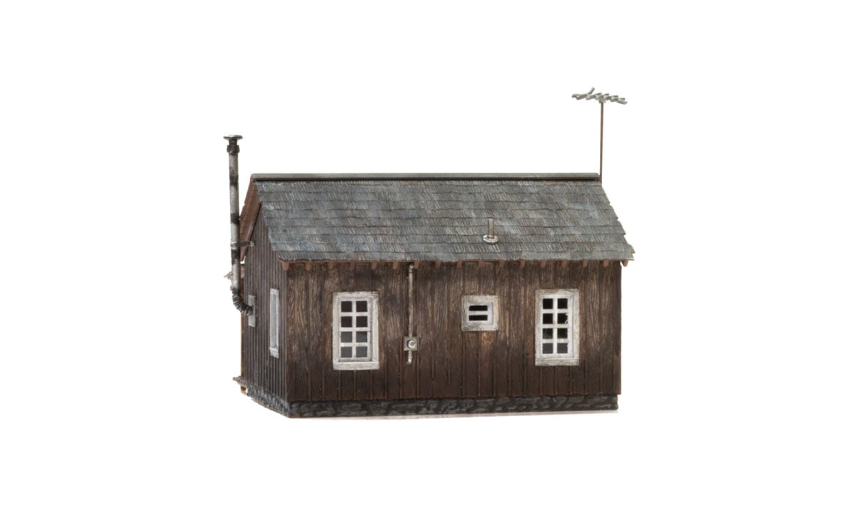 Rustic Cabin - O Scale - Whether you're looking for a getaway in the woods or a home with some country appeal, the Rustic Cabin is the perfect place to sit back and relax in a rocking chair