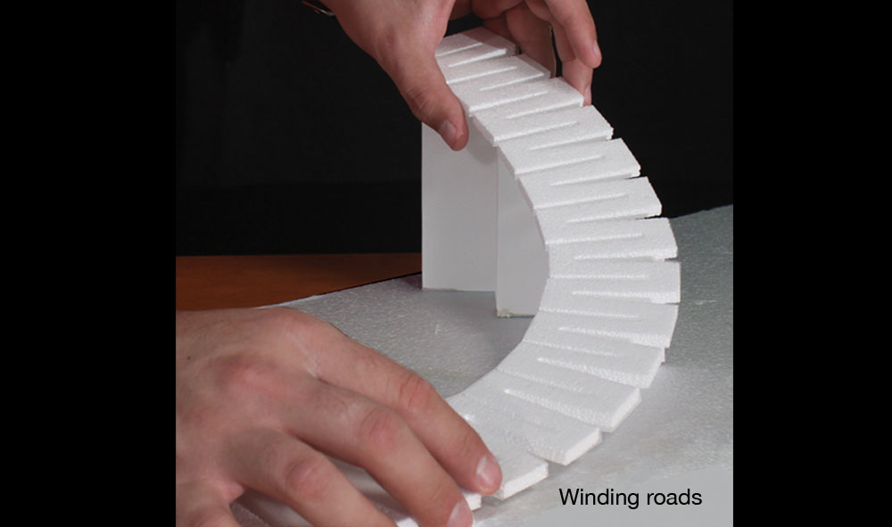 Road Riser<sup>™</sup> - Use Road Riser to establish an elevated road base and instantly set a flat surface for your roads or highways