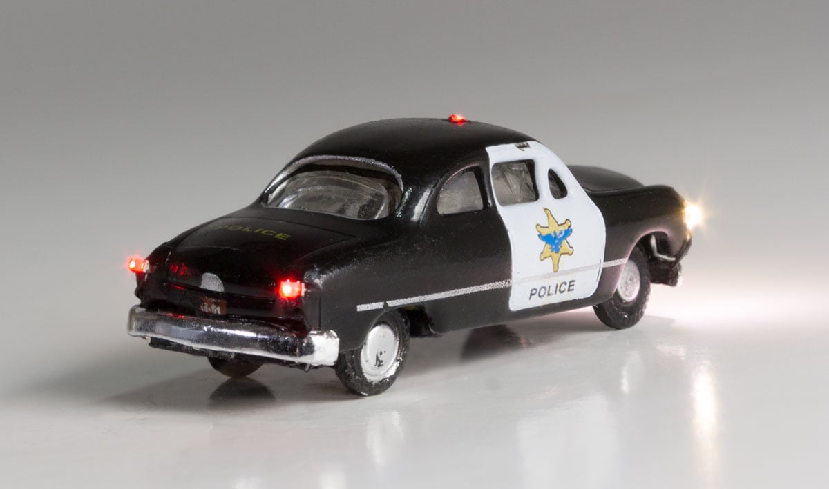 Police Car - N Scale - Protecting the town and looking for hooligans, this Police Car isn't afraid to flag down those rambunctious law breakers
