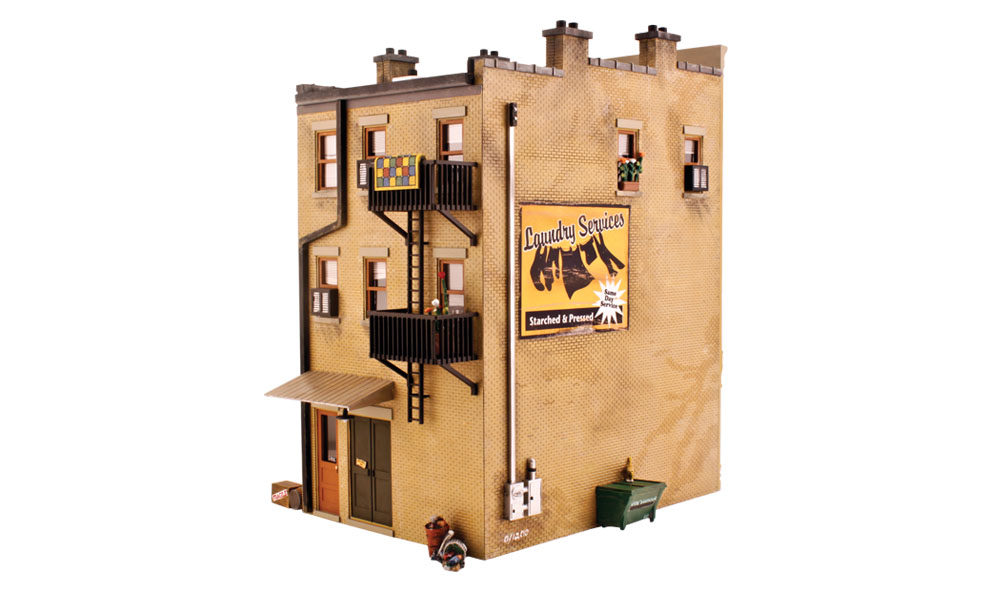 J. W. Cobbler - O Scale Kit - This three-story brownstone features stacked Queen Anne bay windows