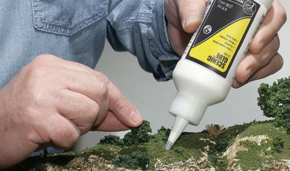 Scenic Glue<sup>™</sup> - A specially formulated, non-odorous adhesive for applying landscape materials