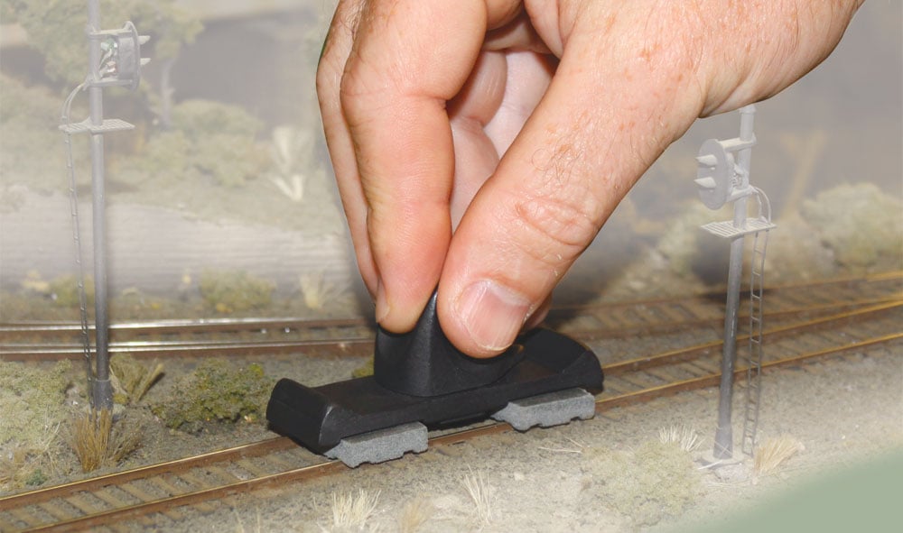 Rail Tracker<sup>™</sup> Cleaning Kit - The Rail Tracker cleaning tool actually follows the track and hugs the rail while you clean