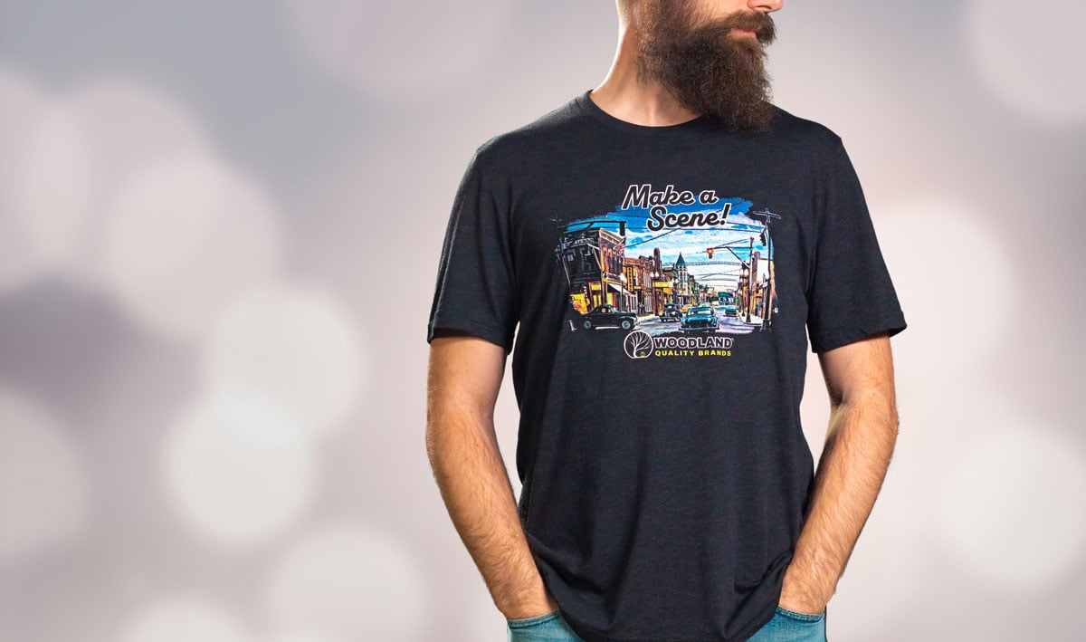 Make a Scene™ T-Shirts  -  Make a Scene&trade; with this artistic Woodland Quality Brands T-shirt! This colorful T-shirt features a detailed miniature scene showcasing new and classic Woodland Scenics® products